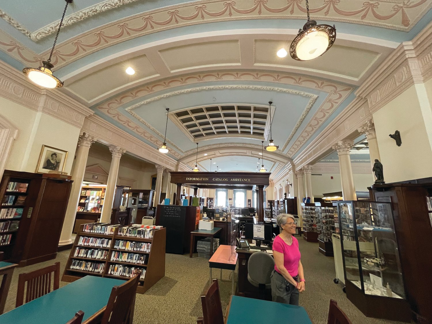 GRAND SPACE: The William Hall Library, dedicated in 1927, sits on the property that once served as the estate of its namesake. Here, librarian Robin Nyzio discusses recent improvements made to enhance the main upstairs space while maintaining its historic character.